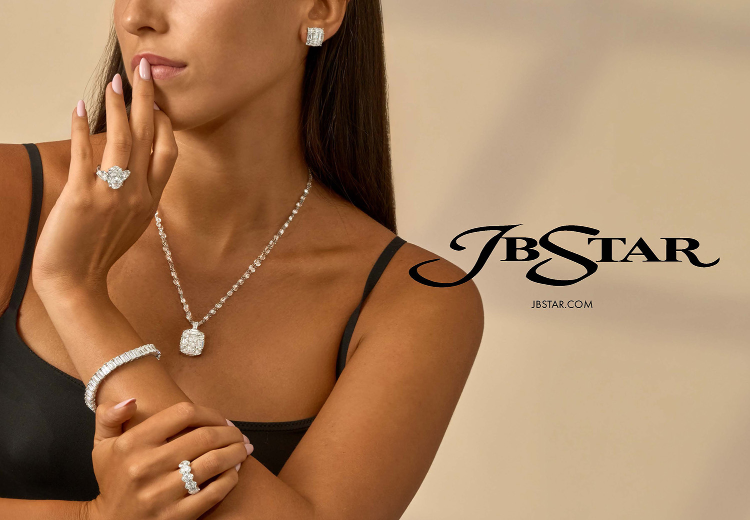 A woman wearing December 2025 JB Star jewelry.